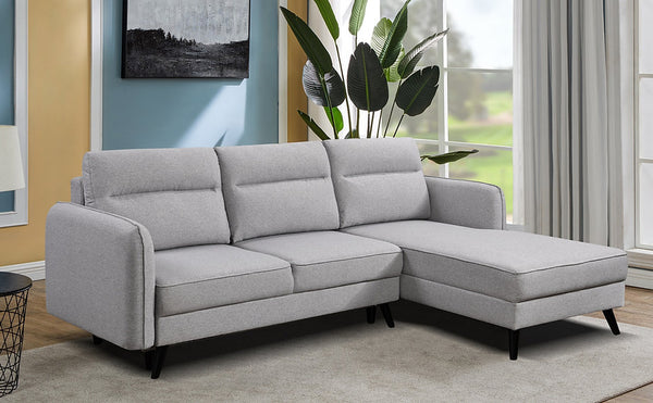 Sectional Sofa bed  in soft grey fabric.