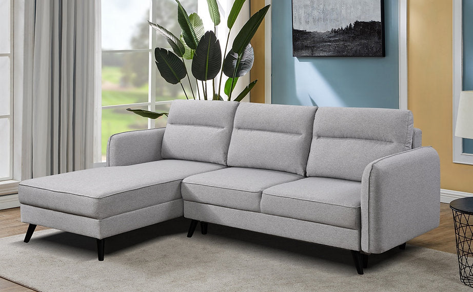 Sectional Sofa bed  in soft grey fabric.